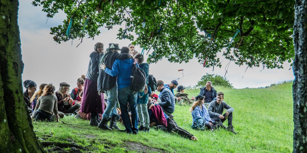 Gathering for summer solstice at Avebury. Credit Colin Drake